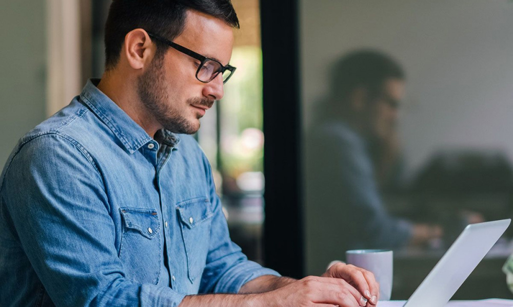 man working at laptop